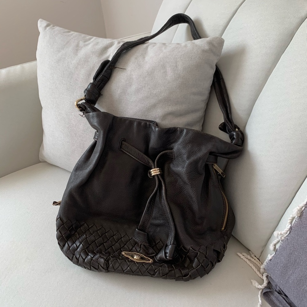 Elliott Luca brown bag hangs at hip